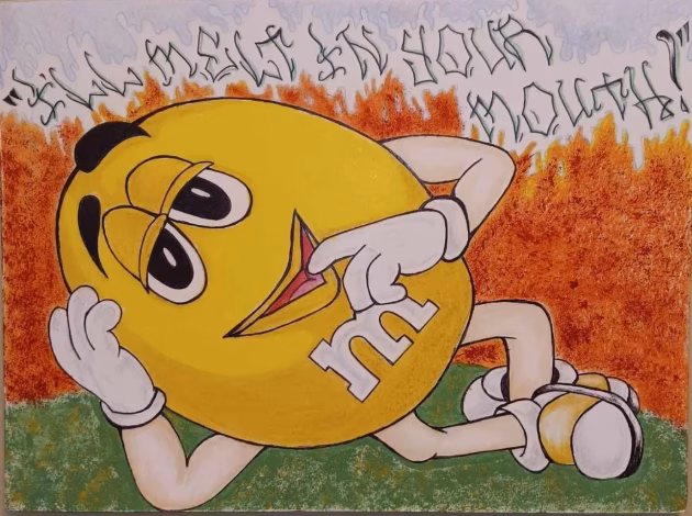 A yellow M&M character with the letter 'm' on its chest lies on its back in a field of orange flowers, pointing to its mouth with the text "I'll melt in your mouth!" written above.